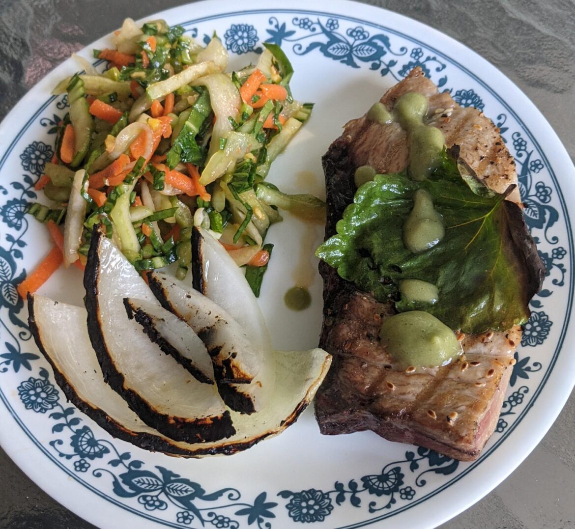 Grilled tuna with hyssop and wasabi. Bok choy ginger slaw and charred onion