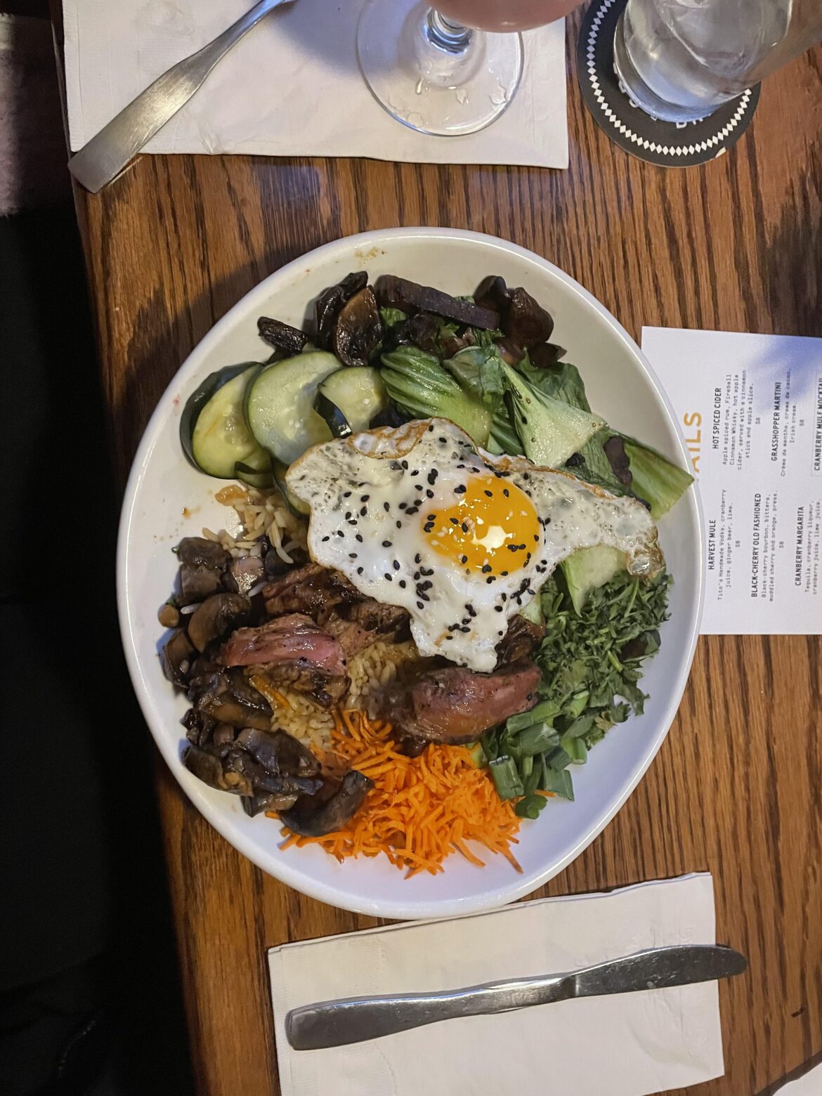 egg over steak, cucumber, scallops, bok choy, mushrooms, carrots, and cilantro from a restaurant i went to!