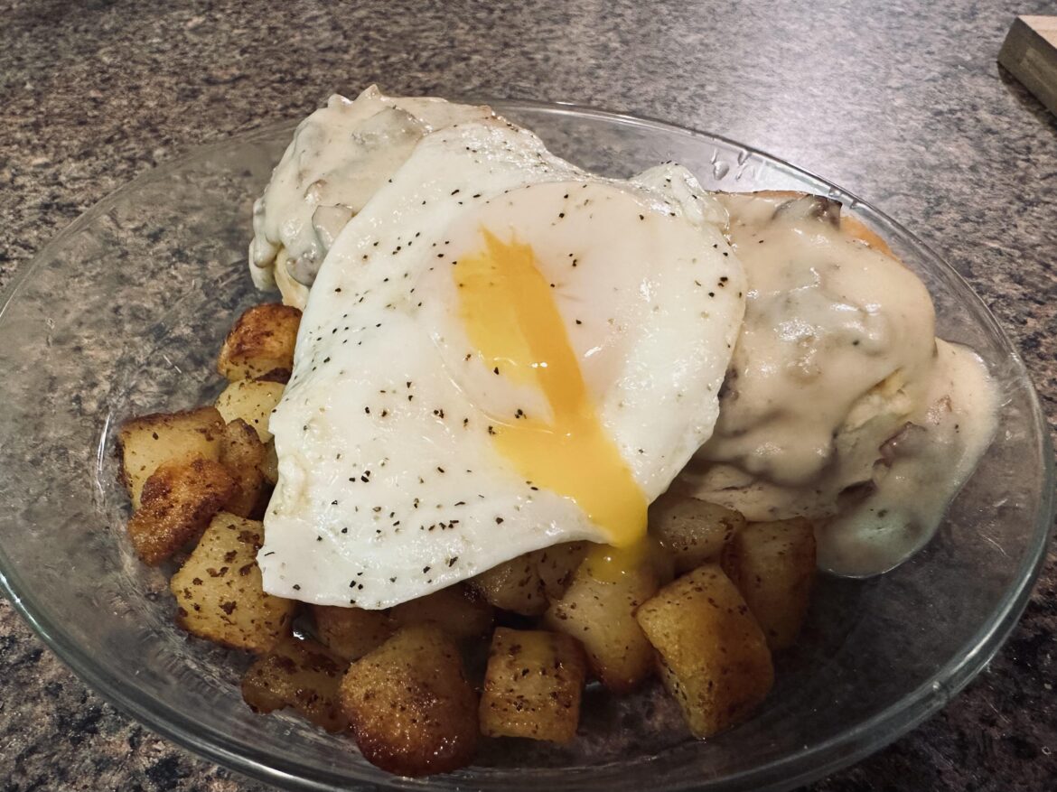 Egg on sausage gravy and biscuits w/ fried potatoes