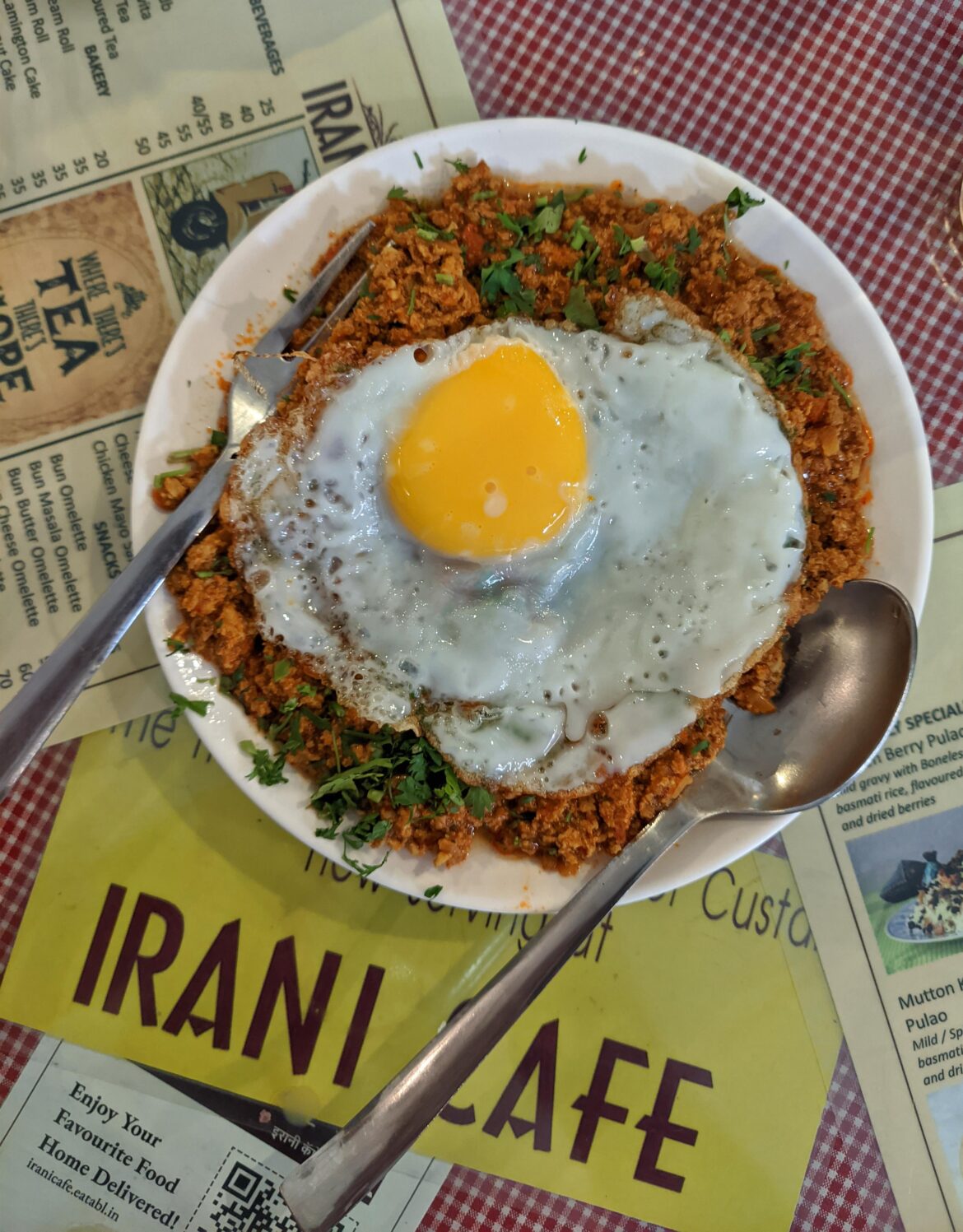 Irani Cafes started long back when migrant Irani people moved to Mumbai for livelihood. This is a classic dish served there - keema par edu which translates to fried egg on top of minced meat. Spicy meaty eggy breakfast to start your day :)