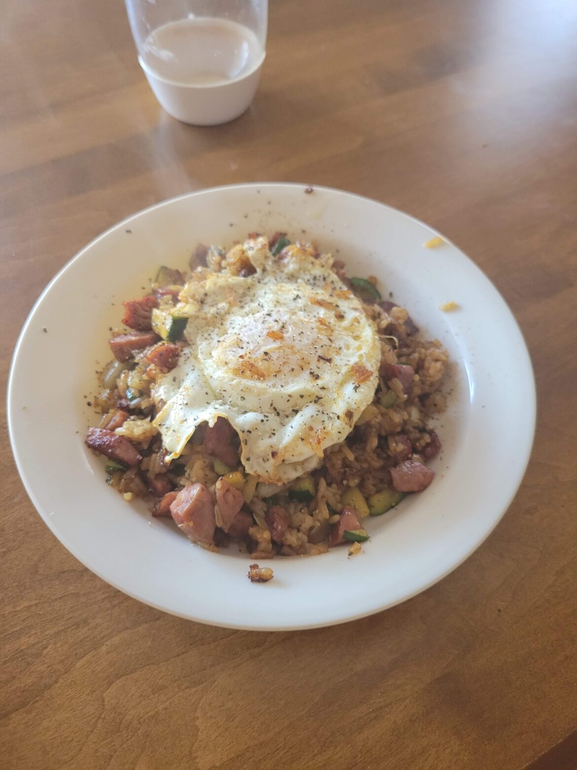 Bratwurst fried rice - Pale Ale Bratwurst, with zucchini, baby bok choy, mushrooms, and of course an egg on top.