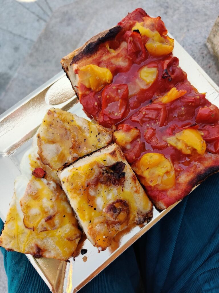 Fresh mixed tomato & white cheese pizza from Magno, Turin eaten in a sunny piazza