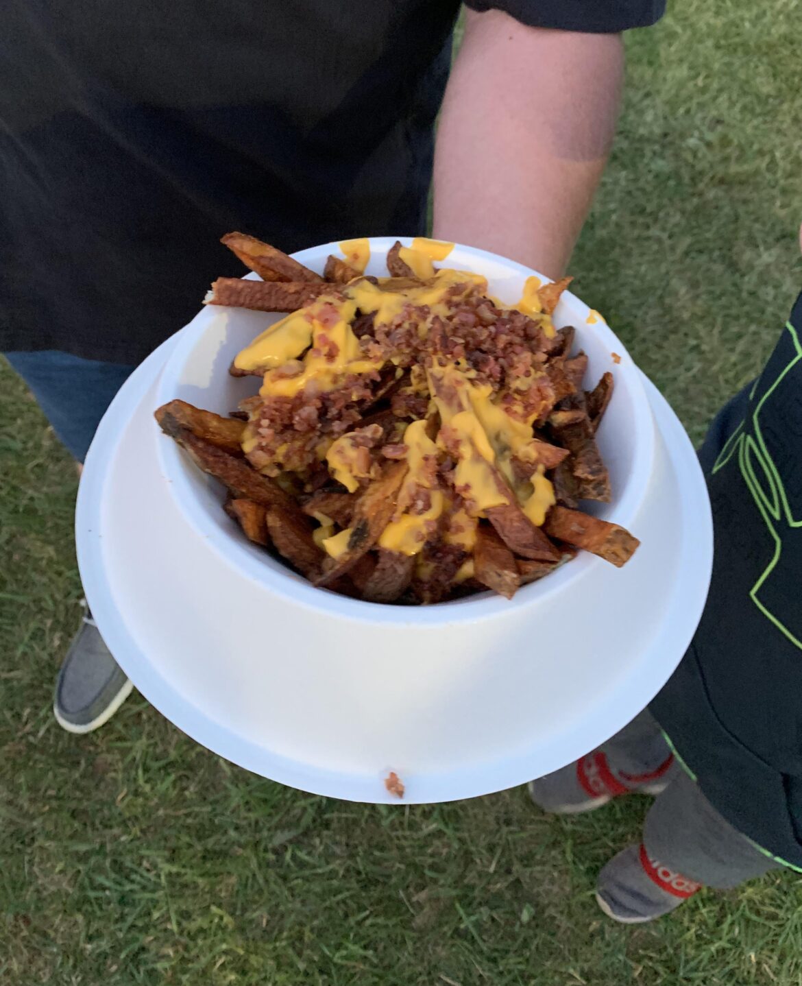 Paper dog bowl filled with cheese fries. Bainbridge Canoe Regatta, NY