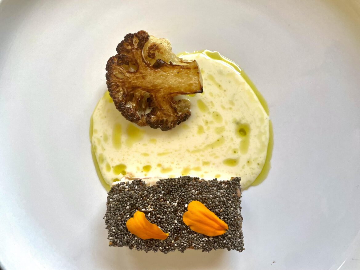 Chia crusted chicken, cauliflower and chive oil sauce, roasted cauliflower