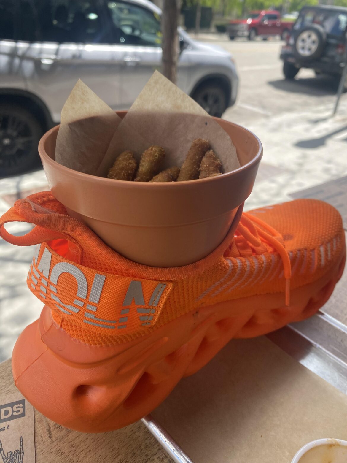 Shoes and a terracotta pot