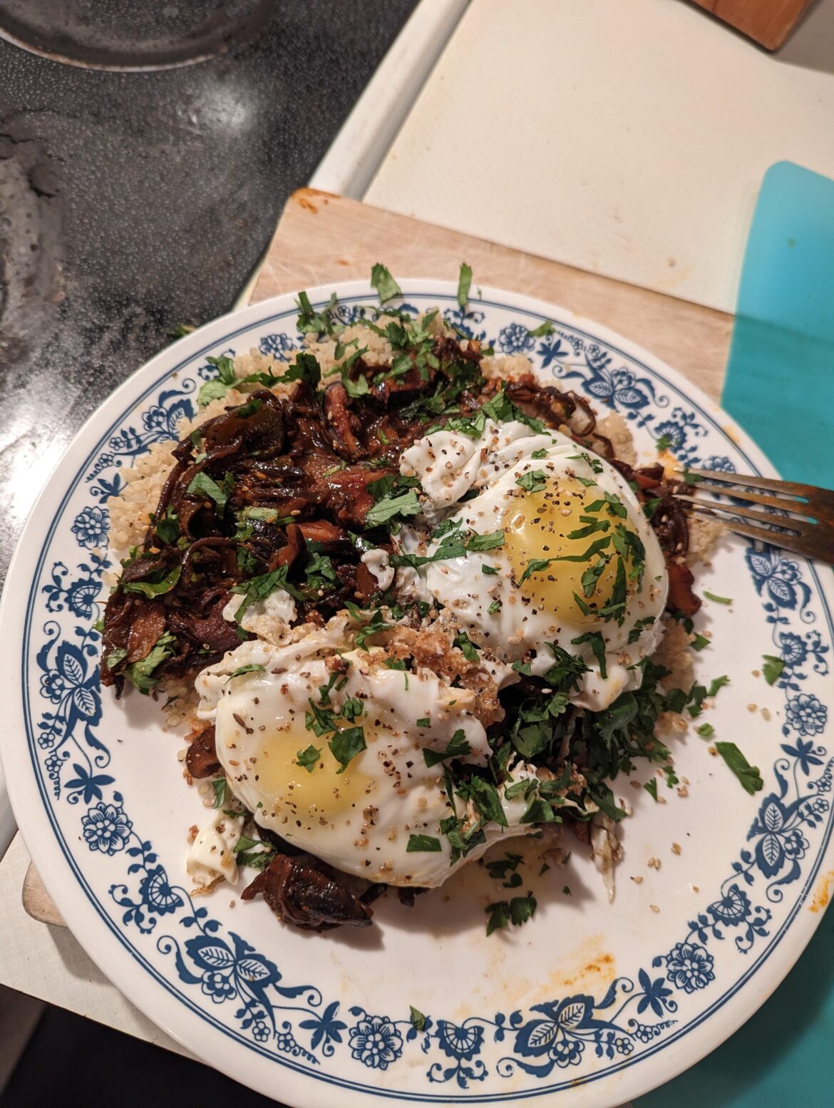 Two beautiful eggs ontop of fried shiitake and white black mushroom simmered in my Gochujang sauce.