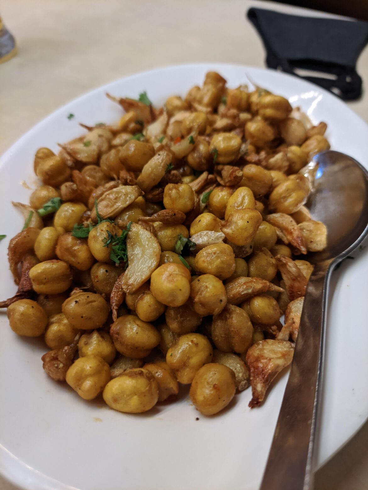Channa Garlic Fry-A common bar snack here in Mumbai, India. Chick peas boiled, deep fried and then roasted with tons of spices and lots and lots of garlic. Helps you gulping your cheap liquor and garlic works like a perfect mouth freshener to save you from cops om the way back and wife back home ;)