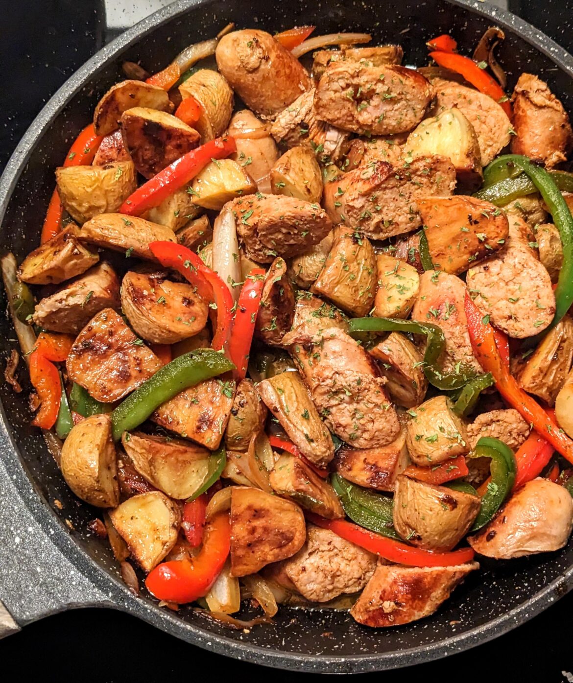 Sweet Italian chicken sausage with onions, peppers, and potatoes