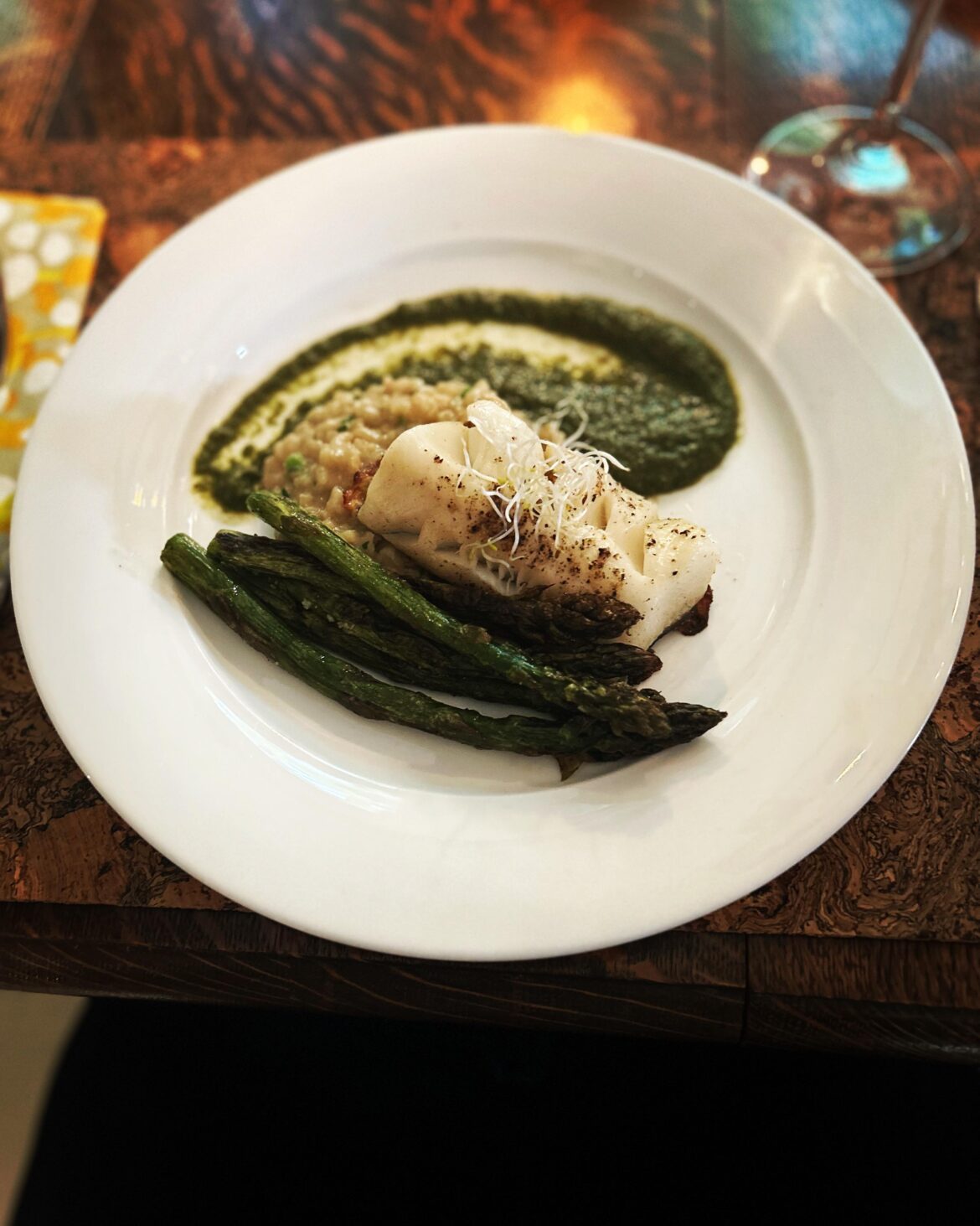 Seared Sable fish with asparagus spring pea risotto and mint pea purée