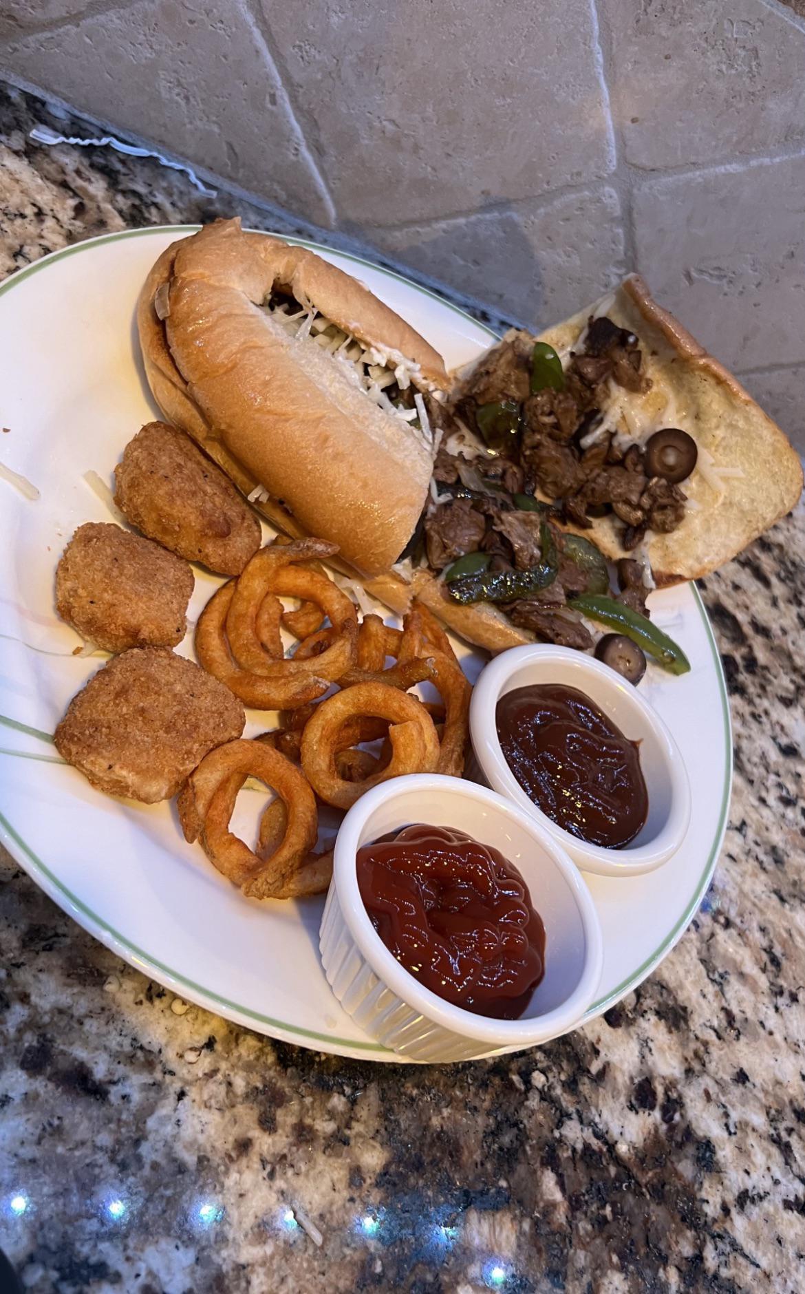 Beyond Steak Hoagie with nuggets & onion rings Dining and Cooking