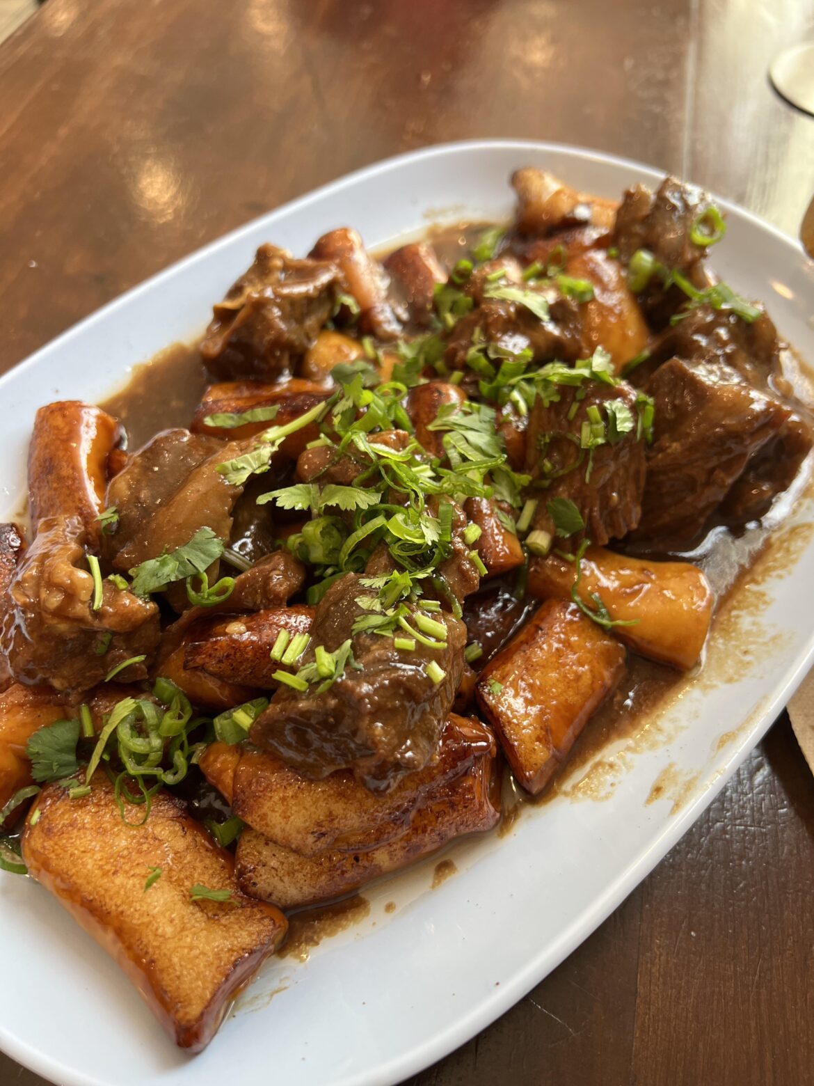 Beef stew over rice noodle rolls at PRD in Chinatown