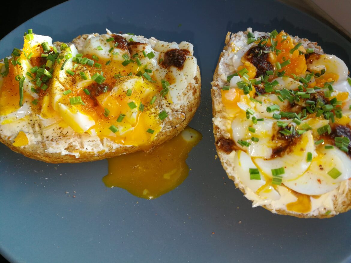 Whole grain buns having a party on the top deck. Present are: Cream Cheese, Soft-Boiled Egg, S&P, Chives and Queen Majesty Cocoa Ghost Hot Sauce. The party was awesome.