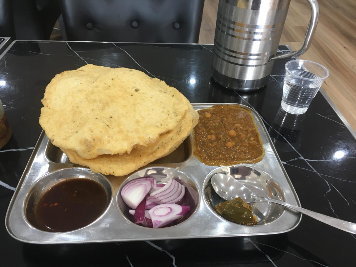 Chole Bathura. Deep fried North Indian flatbread with fragrant chickpeas.