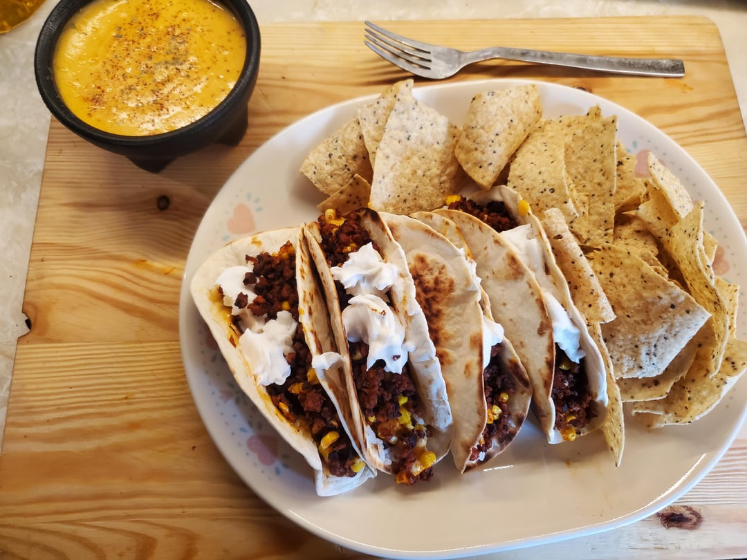 Trader Joe's Soy Chorizo. Homemade nacho cheese dip. Some rice, corn, and wayfare sour cream