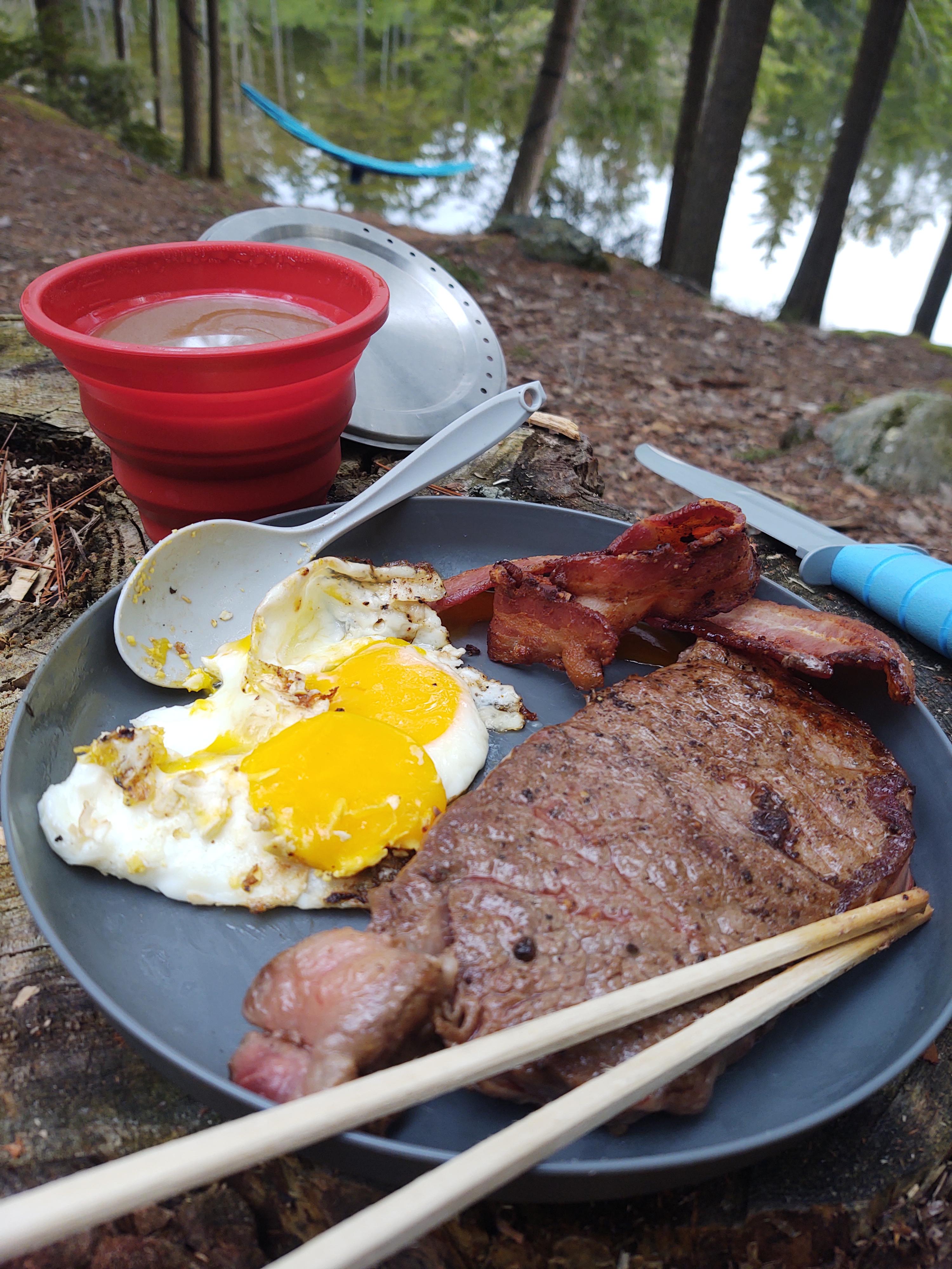 Wagyu NY Strip Steak and eggs for breakfast cooked on cast iron