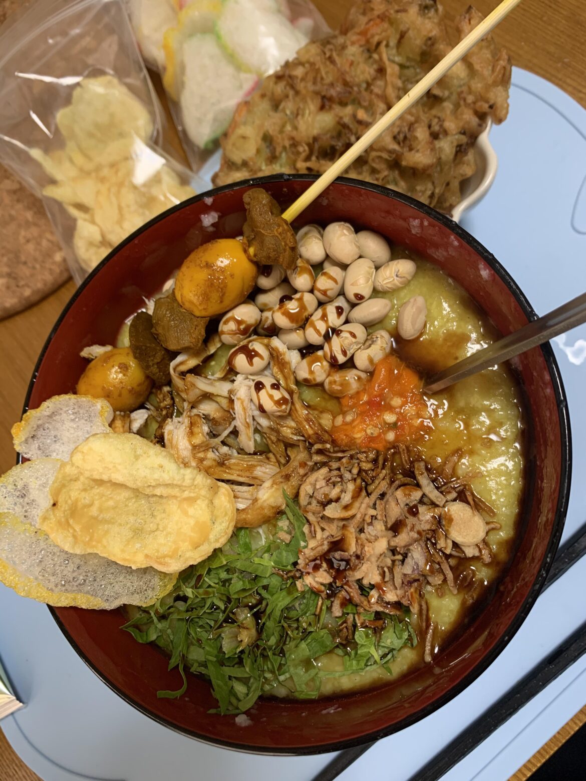 Bubur Ayam, Indonesia (mainly Jakarta). Rice porridge with turmeric chicken and other toppings.