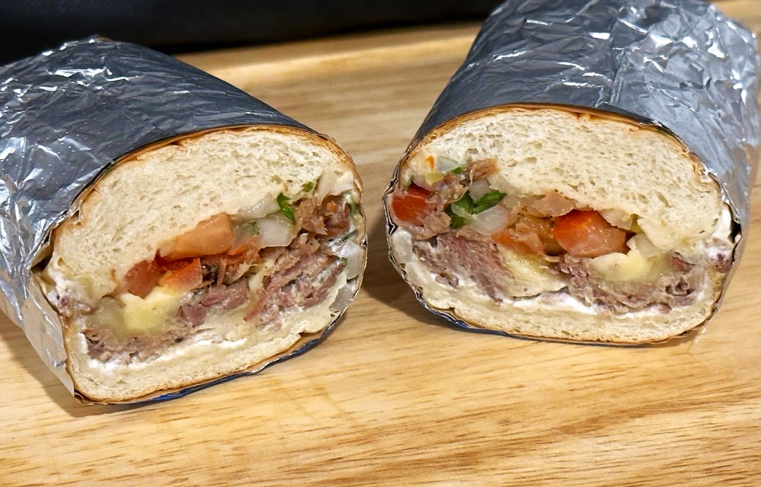 leftover carnitas sub (spicy sour cream, pico de gallo and melted