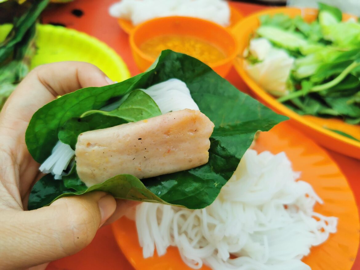 The locals call this "Song Vak" apparently fermented fish cake vegetables wrapped dip in fish sauce