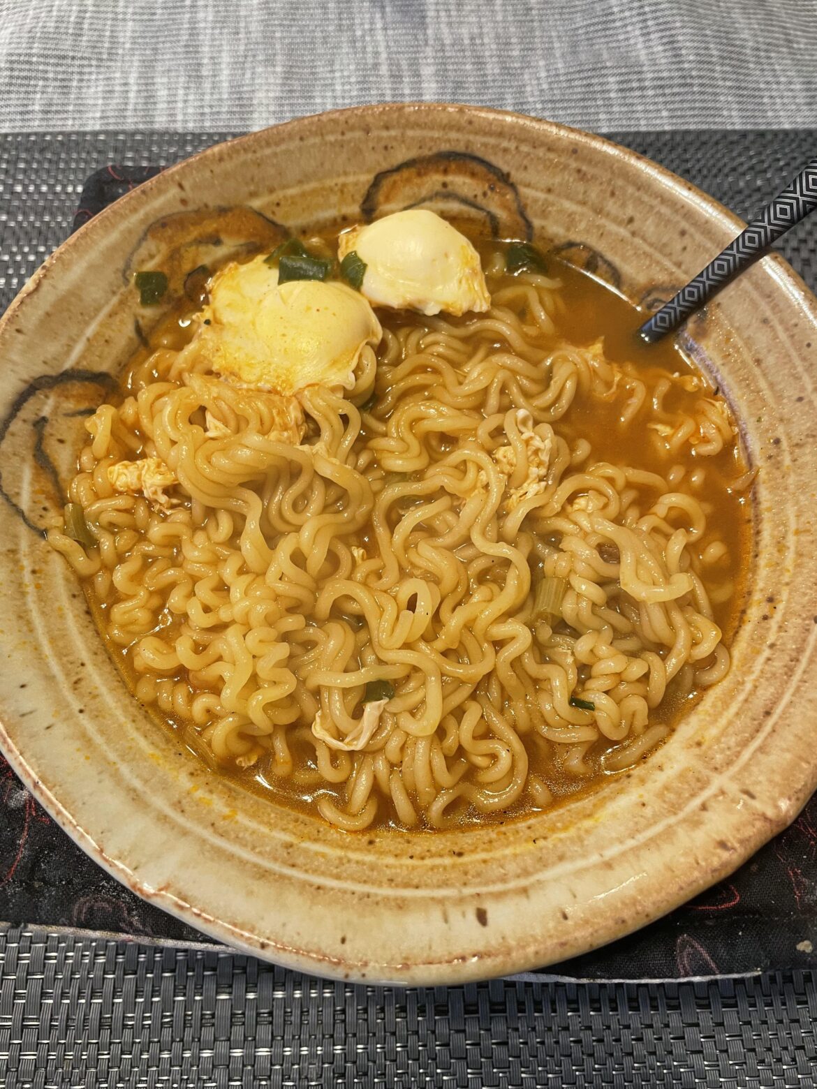 spicy ramen with quail eggonit, they look like little man o’ war jellyfish