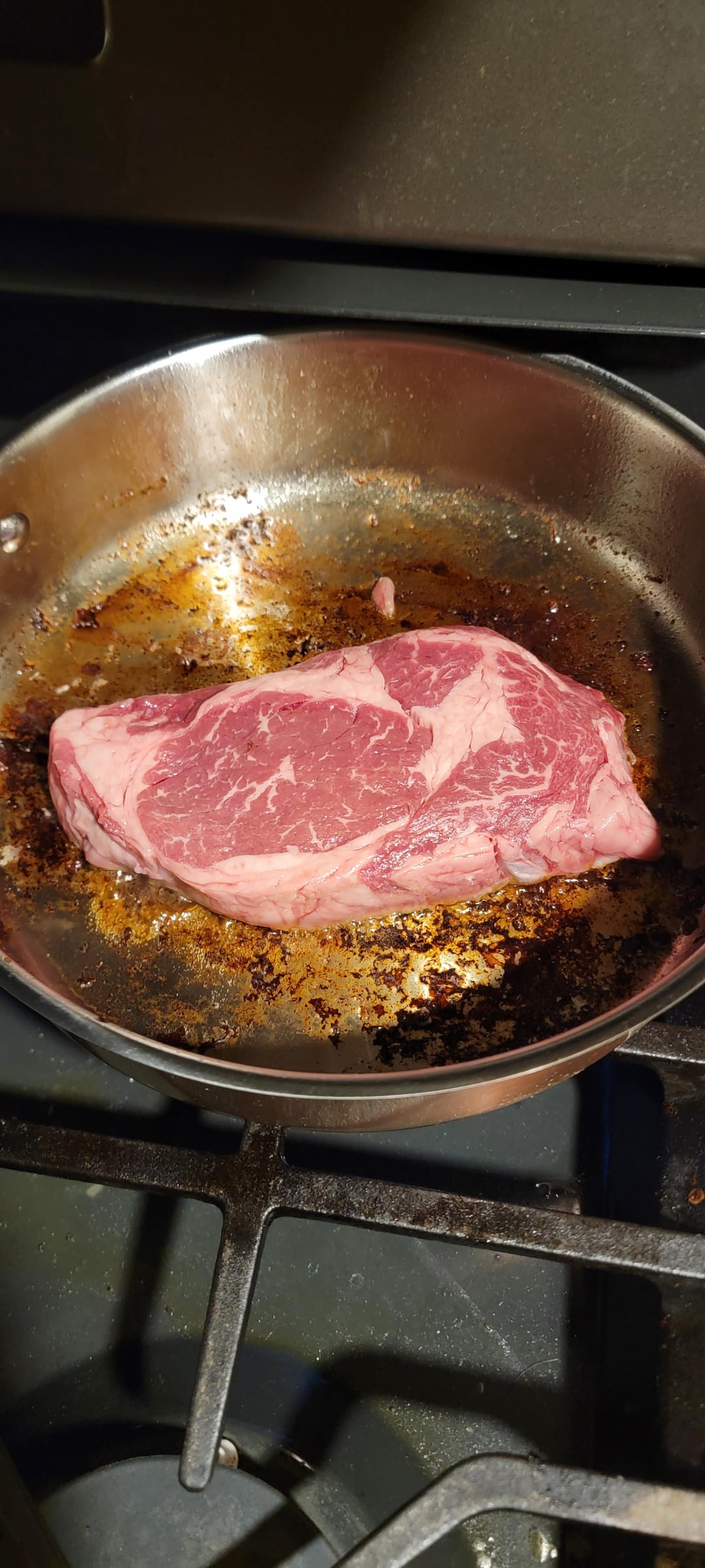 Pan seared organic Angus ribeye fried in bacon grease. Dining and Cooking