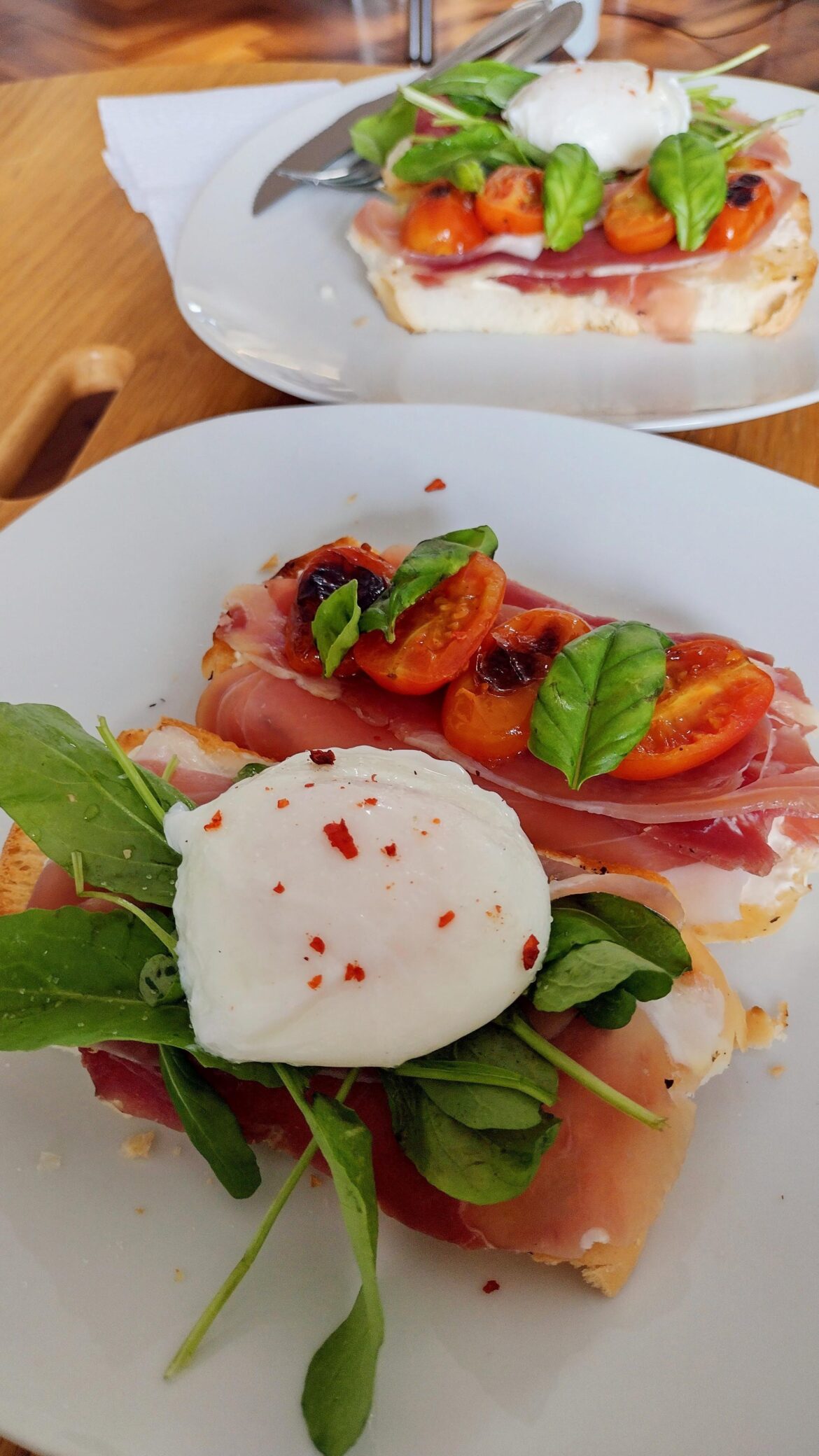 my first (and second, pictured in the background) poached egg, on top of prosciutto, tiny tomatoes and other scraps