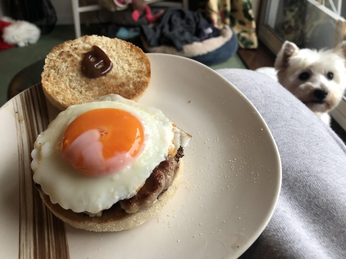 Sausage and cheese muffin with brown sauce and lovely eggy boi. The yolk glooped all over the place. Yum