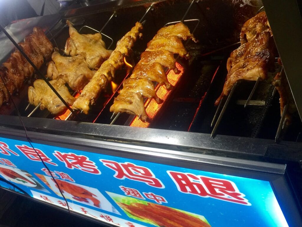 “Unlimited” supply of grilled chicken and beer for our end of semester party . Swipe for a close up. - Wuhan