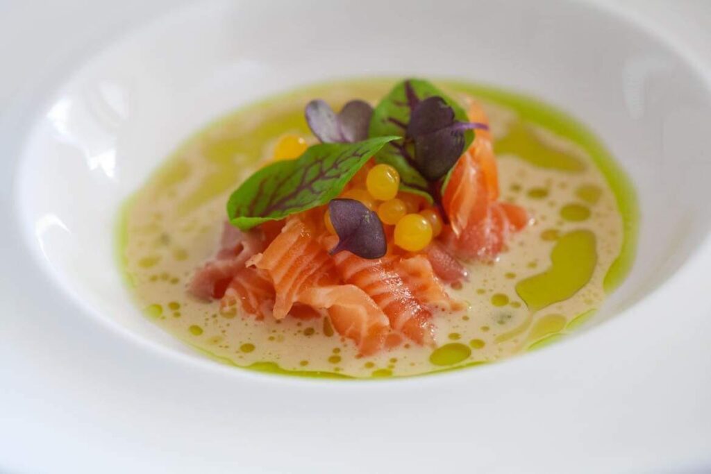 Salmon ceviche with katsubushi stock and grapefruit pearls