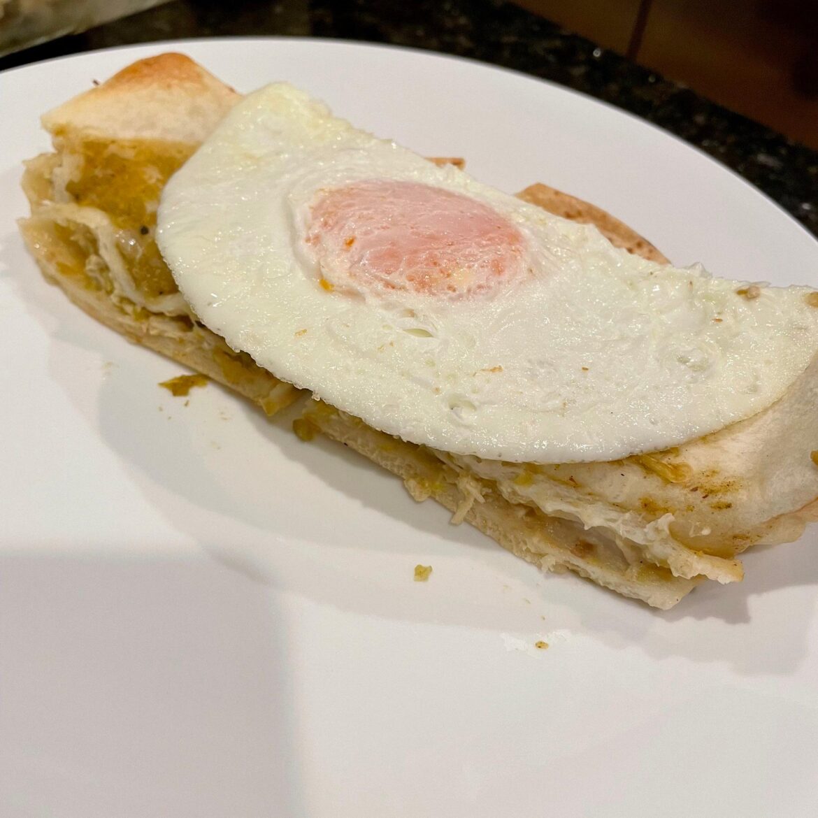 Over easy on last night's leftovers (Homemade shredded chicken enchiladas)