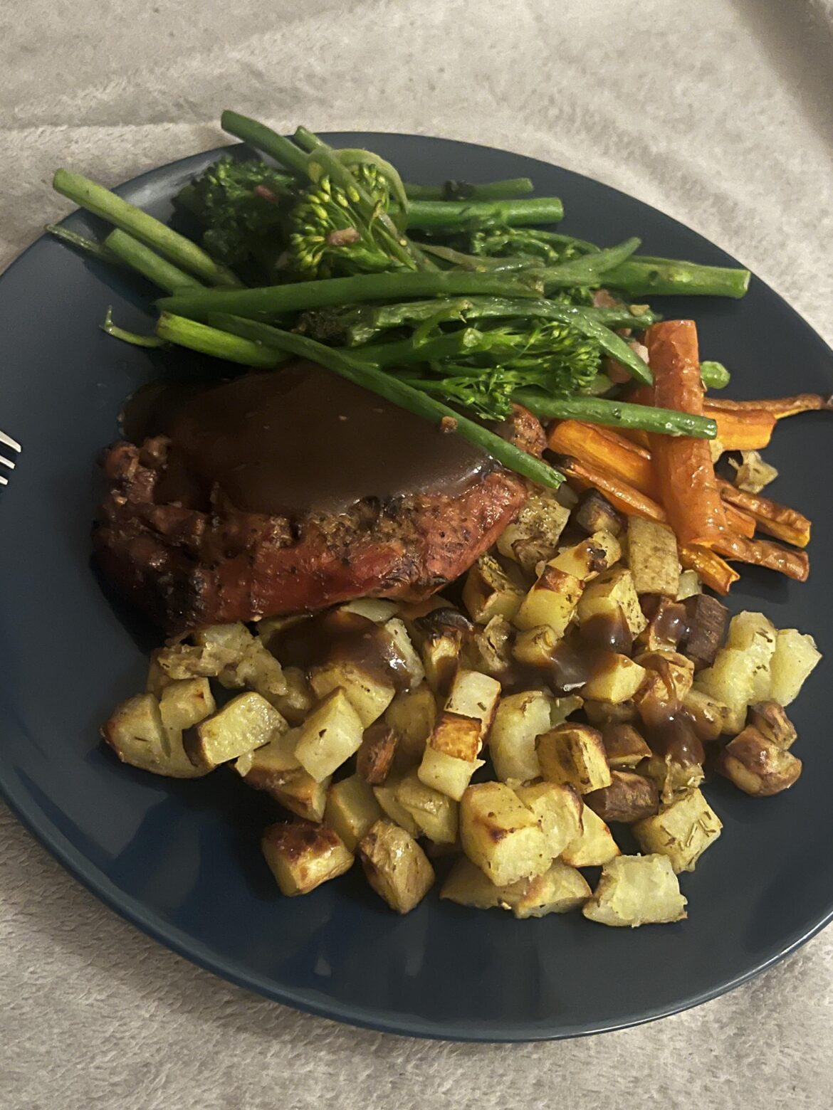 Confit duck leg with potatoes and veg