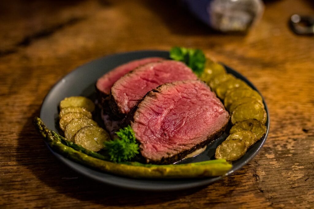 Sirloin steak, mushroom sauce, and sliced, oven roasted potatoes