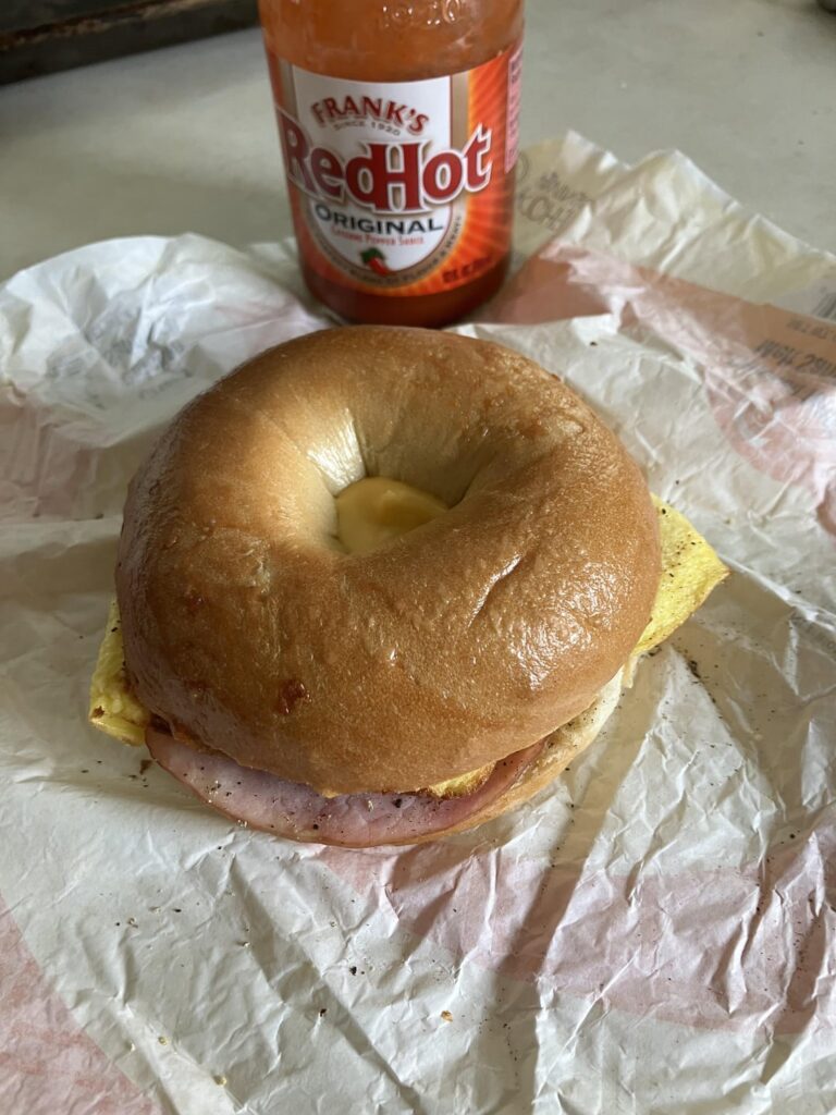 Local gas station chain (kwik trip) breakfast sandwich. Ham cheese and pepper / onion omelet on a bagel. I’m heading down to Chicago for Dead & Co in a few hours and didn’t want to cook