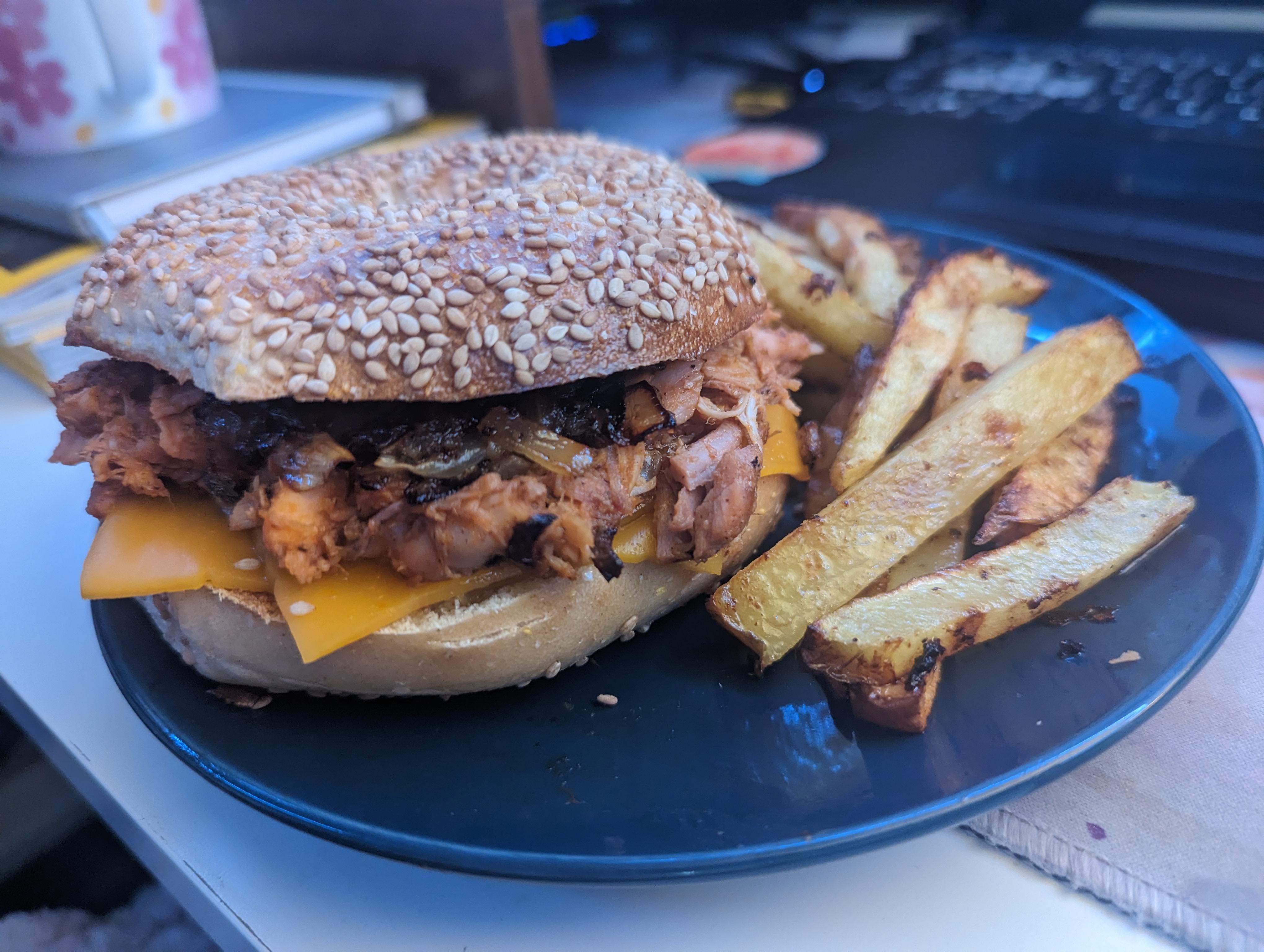 Rotisserie chicken bbq sandwich with cheddar cheese and sauteed onions