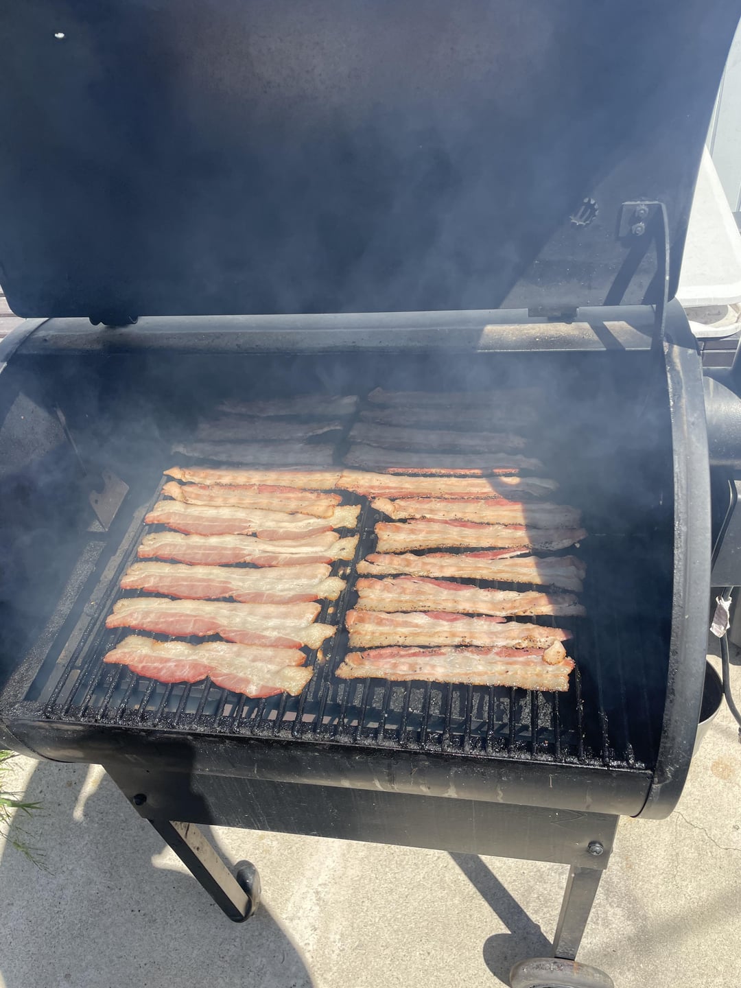 Got the bacon on the pellet smoker and burgers on the grill. Dining