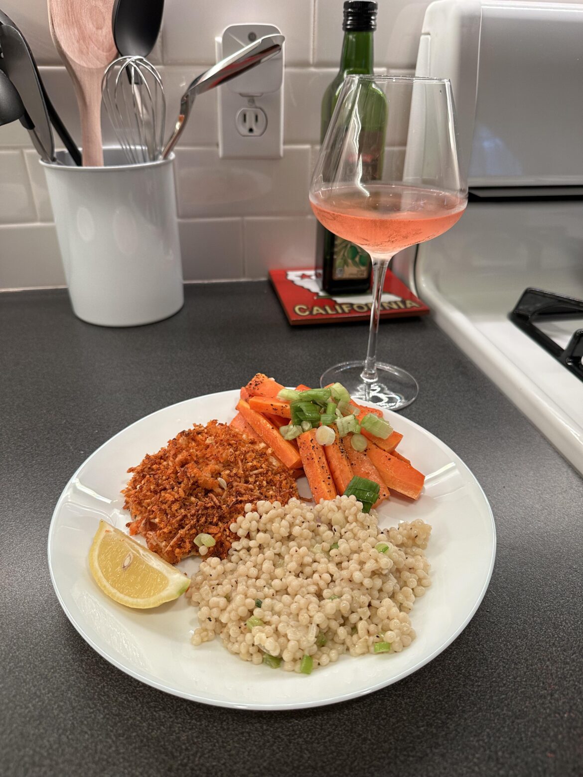 Crispy Parmesan Chicken with Garlic Scanlon Couscous and Lemon Roasted Carrots.