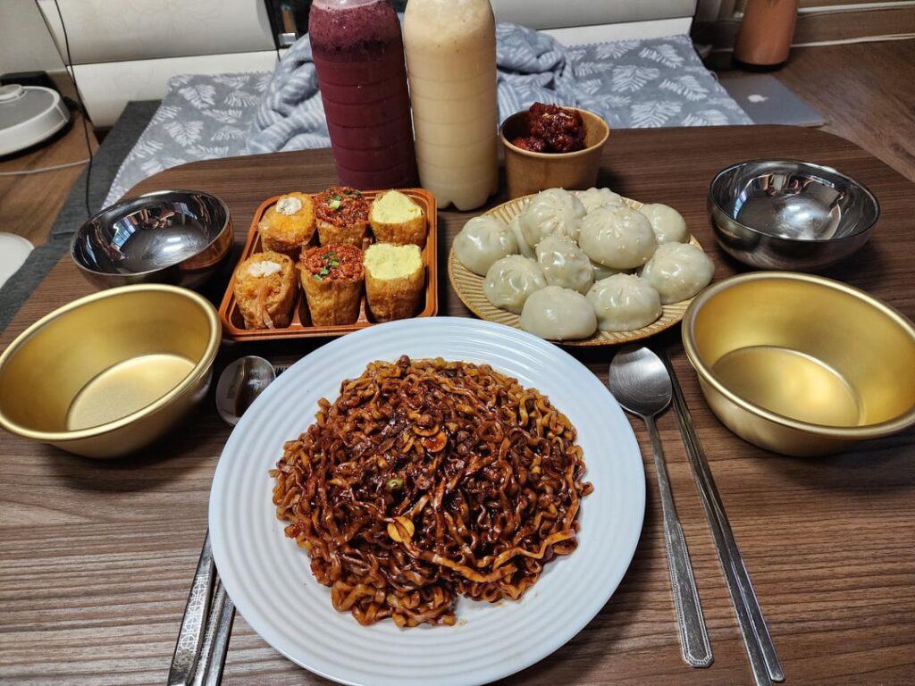 Dinner in bed! Made the new Jin jjajangmyeon, Mandu, and dubu chobap! Also went and picked up some house made blueberry and banana makgeolli from the local makgeolli house!