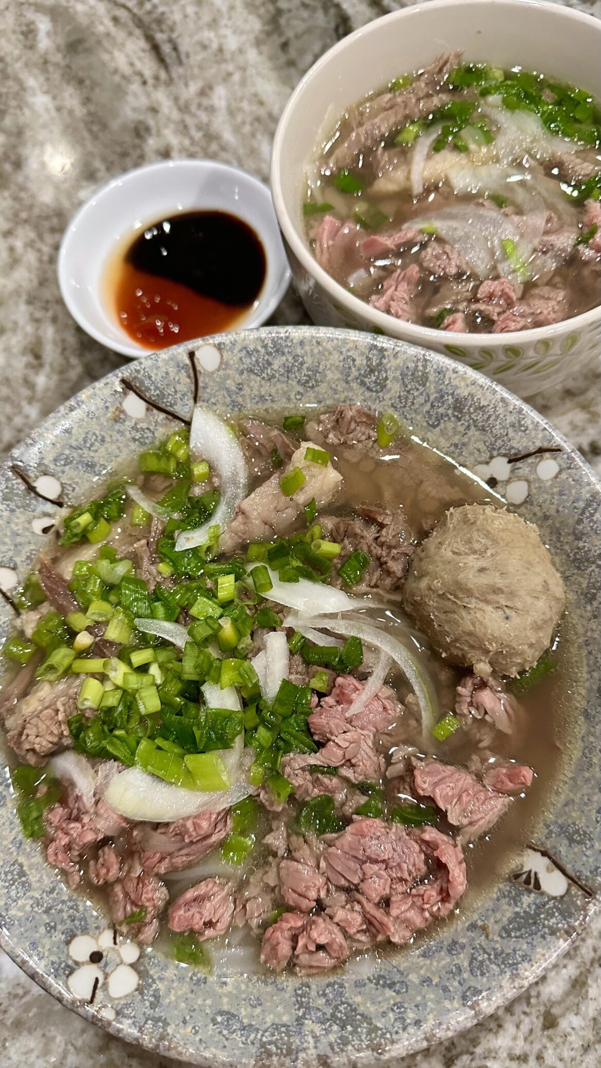 [Homemade] Vietnamese Pho with medium-rare ribeye, well-done flank, and beef balls. Don’t forget Sriracha & Hoisin sauce!