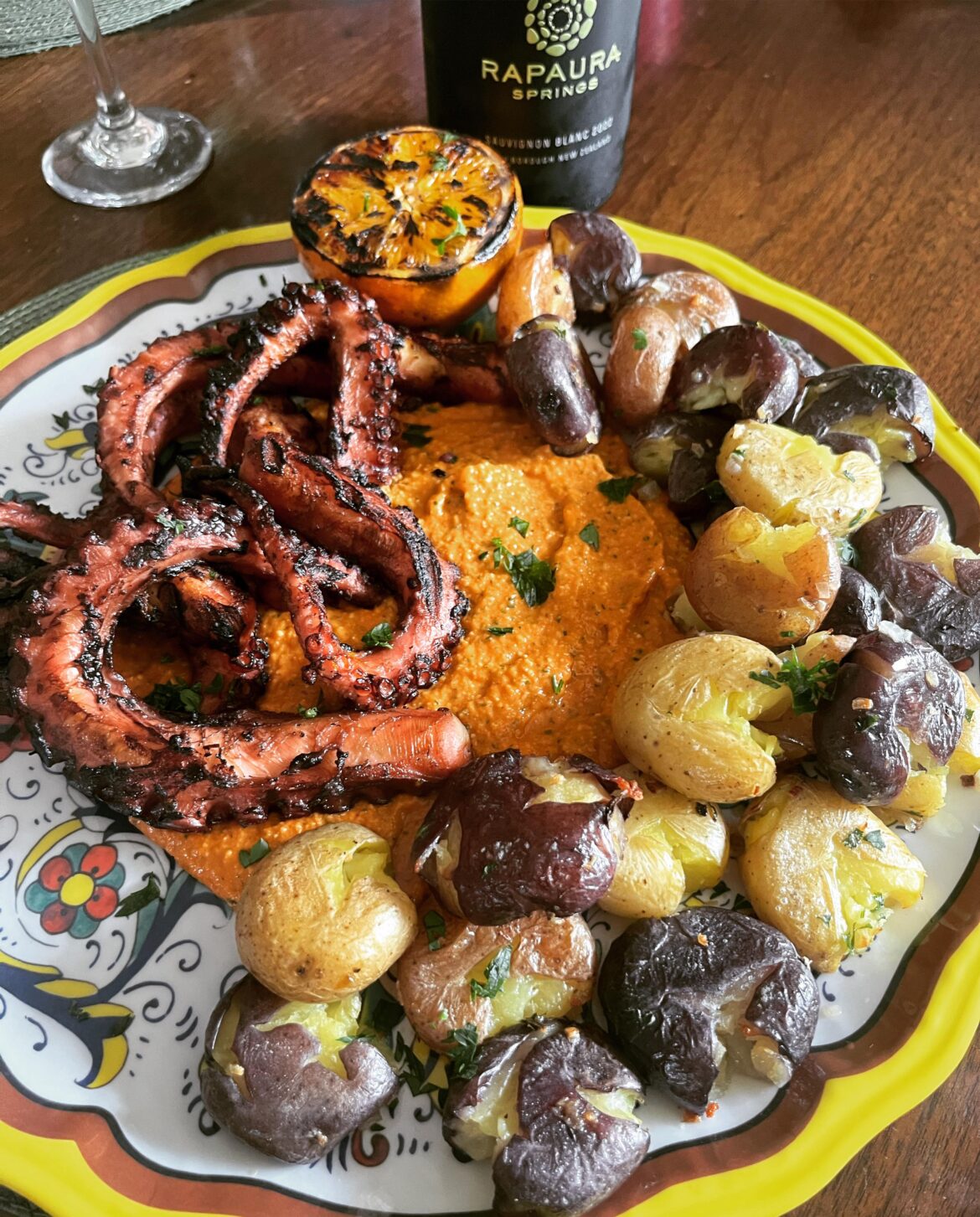 6 hour octopus seared over fire w romesco and smooshed new potatoe