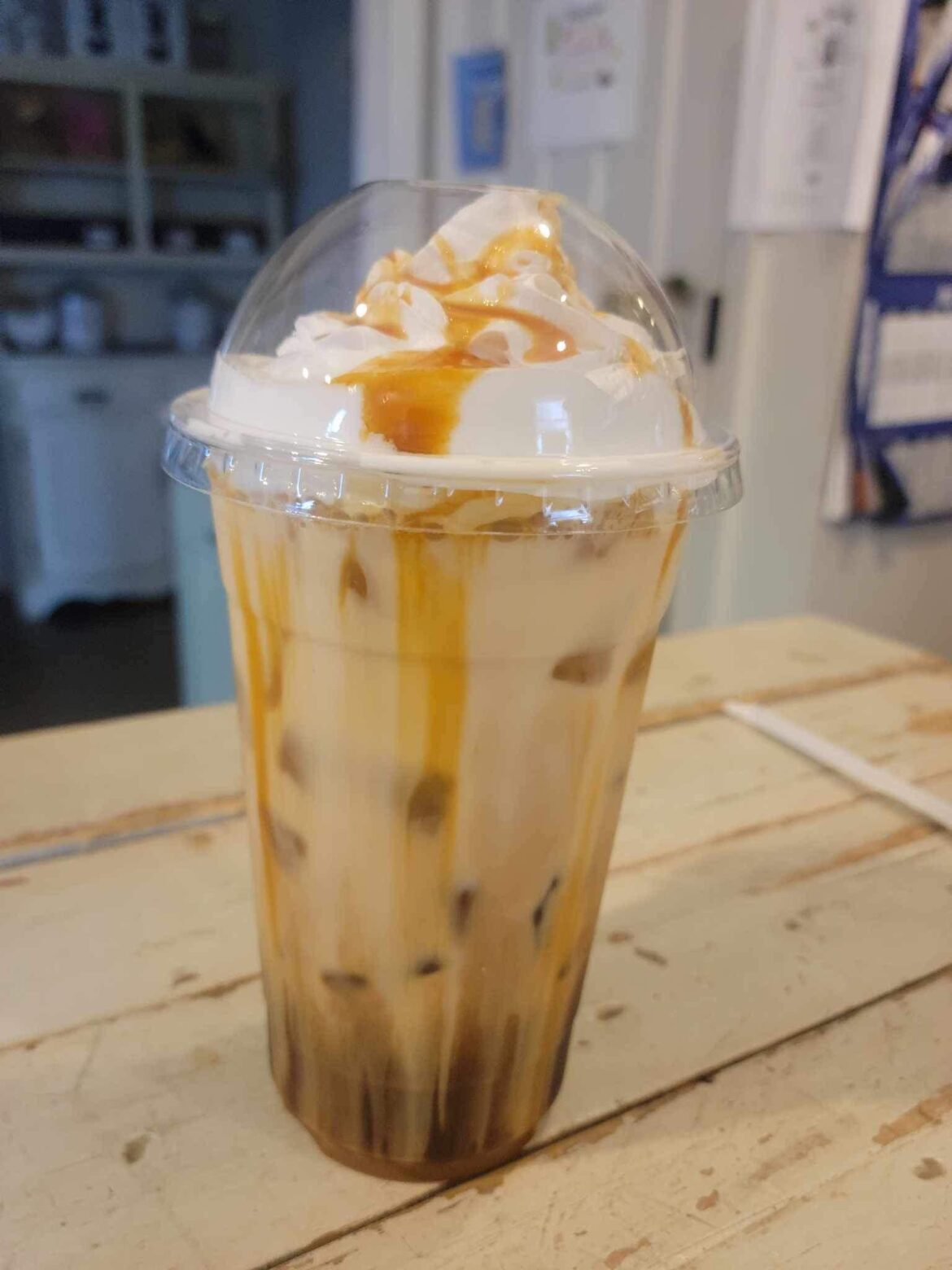 an iced french vanilla and hazelnut latte with caramel drizzle I made today. 😋