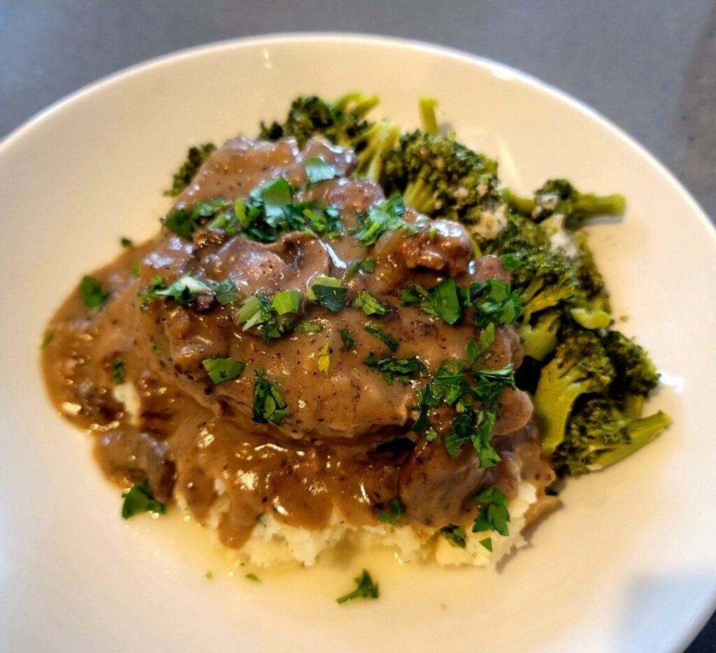 Smothered Pork Chop over Mashed Potatoes