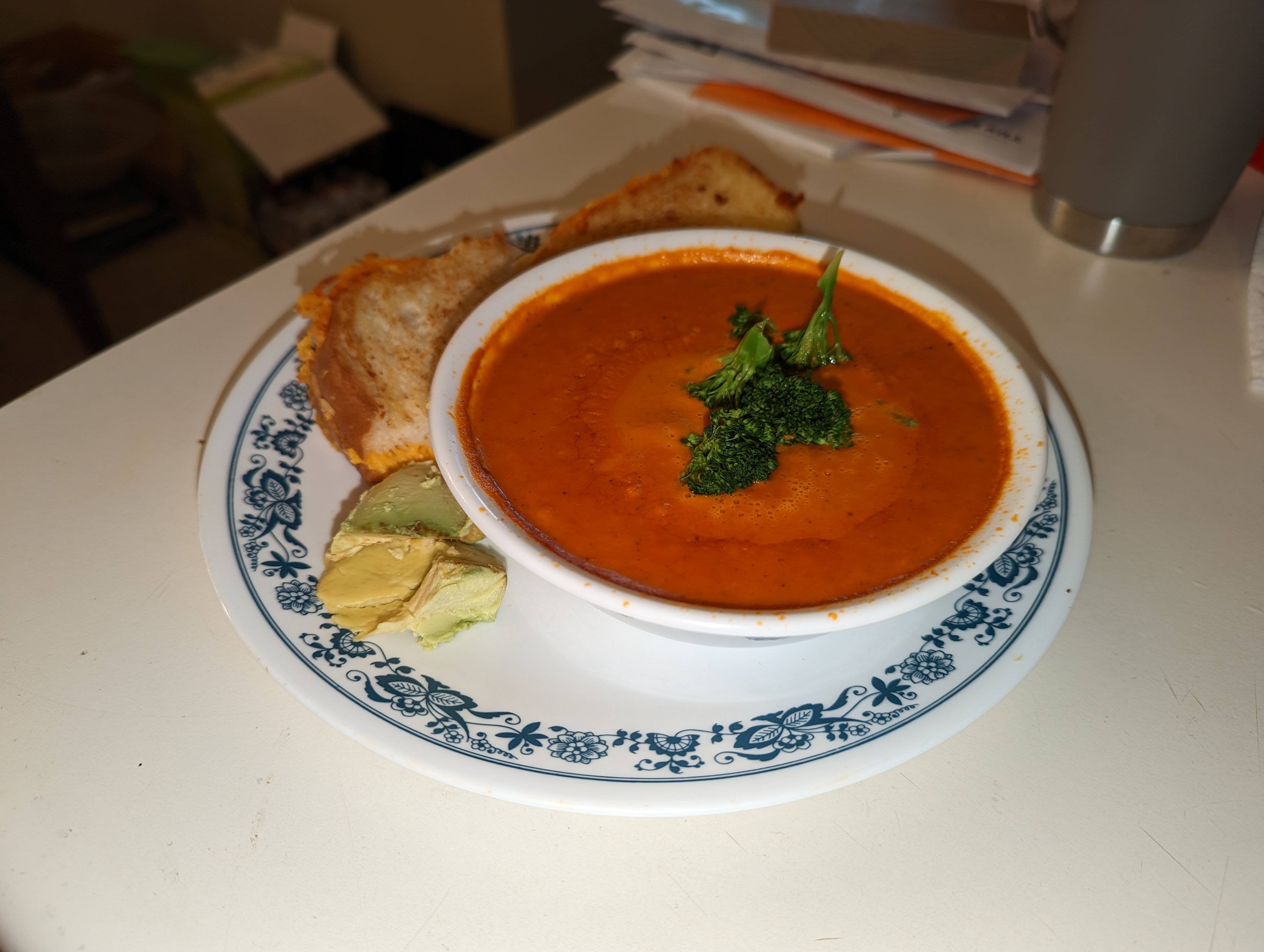 Grilled cheese and tomato soup with some avocado and broccoli Dining
