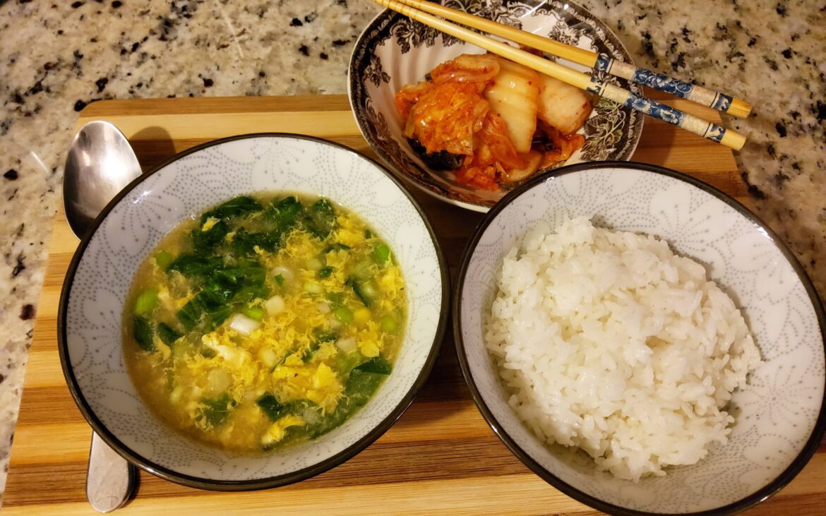 Easy and simple eggdrop soup with corn and chopped romaine.