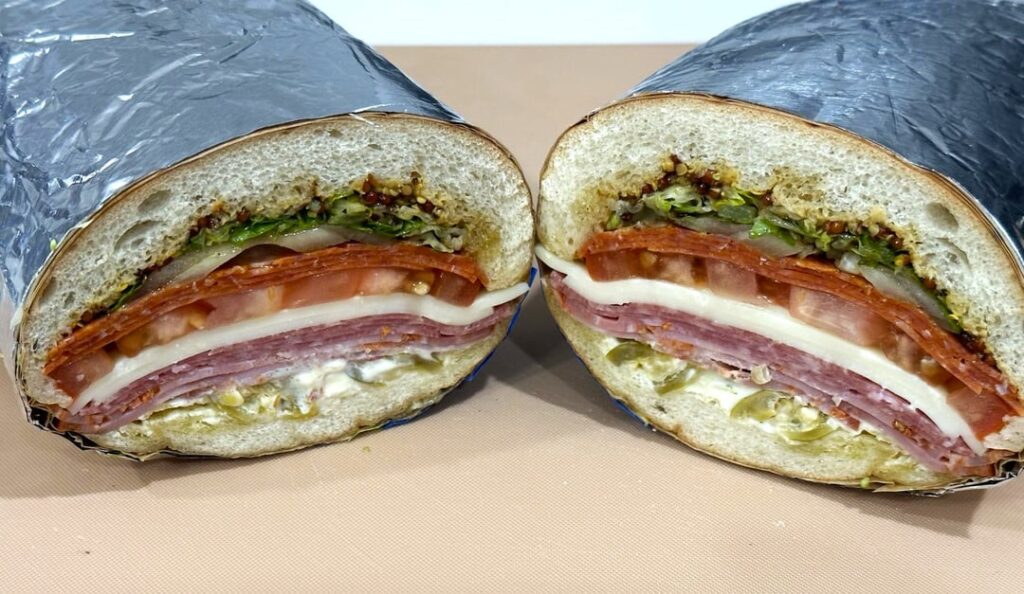 italian sub: salami, pepperoni, capicola and provolone w/stone ground mustard, deli dressing, giardiniera, mayo, lettuce, tomato and onion.
