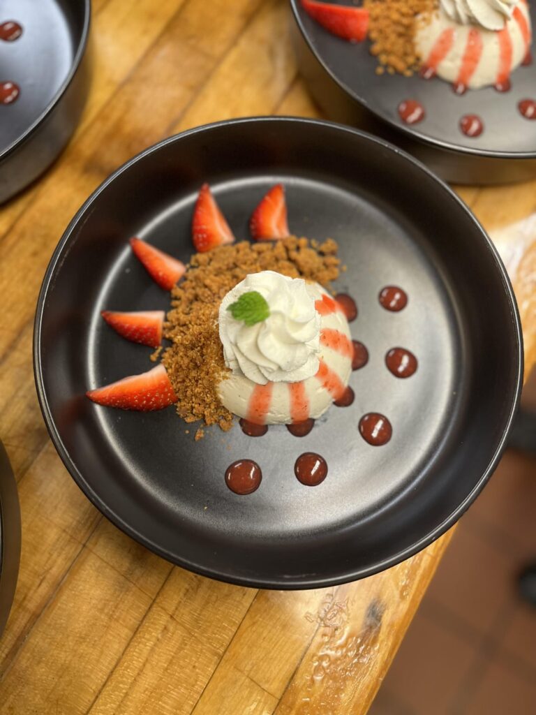 Honey, Vanilla, Cardamom Panna Cotta; Browned Butter Crumble; Amaretto Strawberry Sauce; Sage and Clove Chantilly Whip; Fresh Strawberry