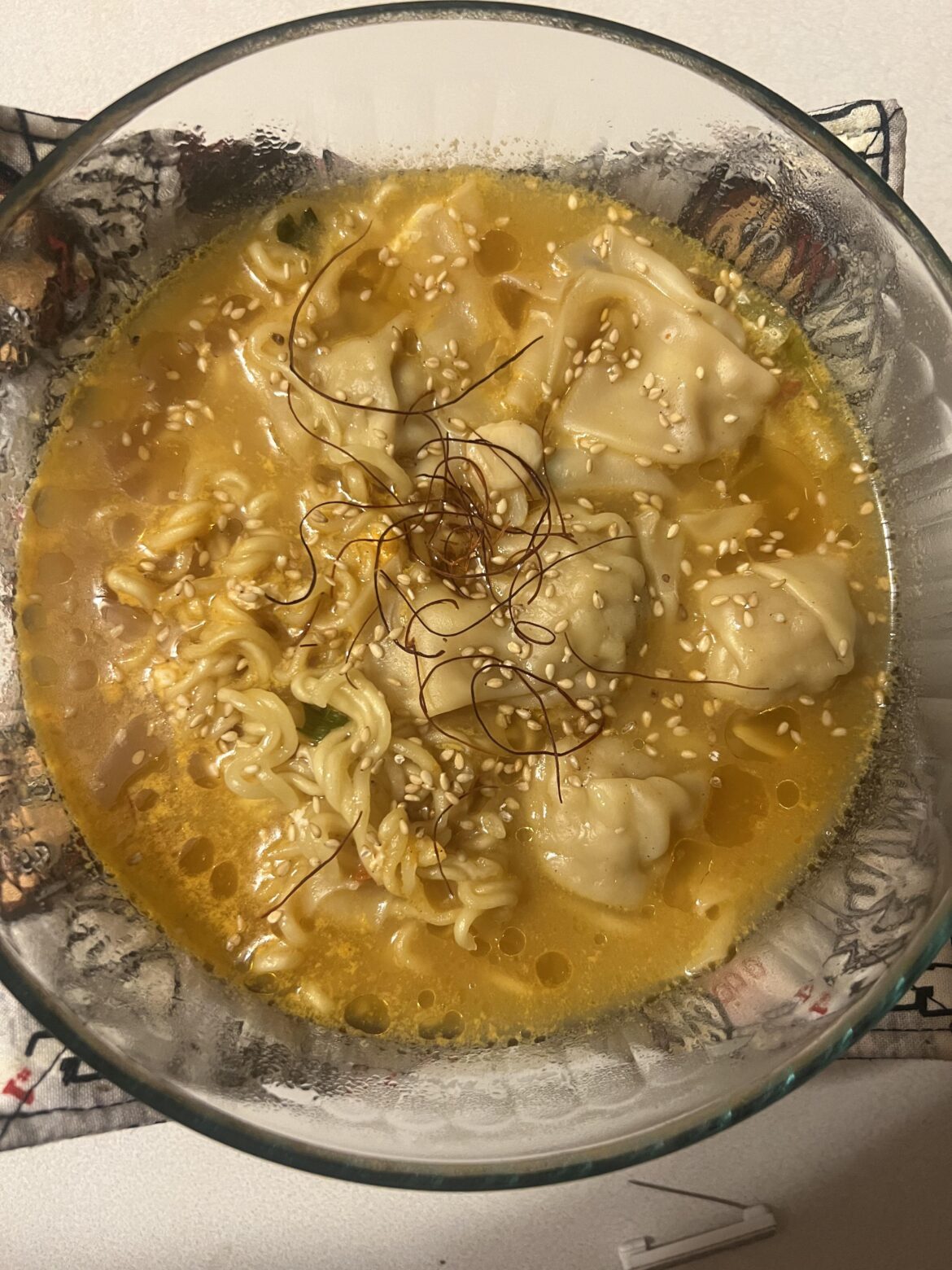 Nongshim beef bone broth Shin Black - shrimp & pork wontons - sesame oil - sesame seed - red pepper thread