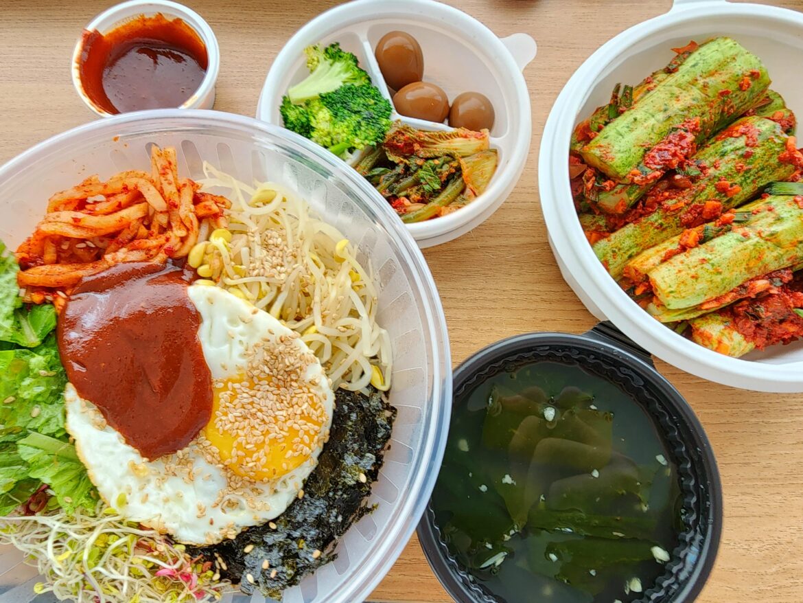Bibimbap delivery with some cucumber kimchi
