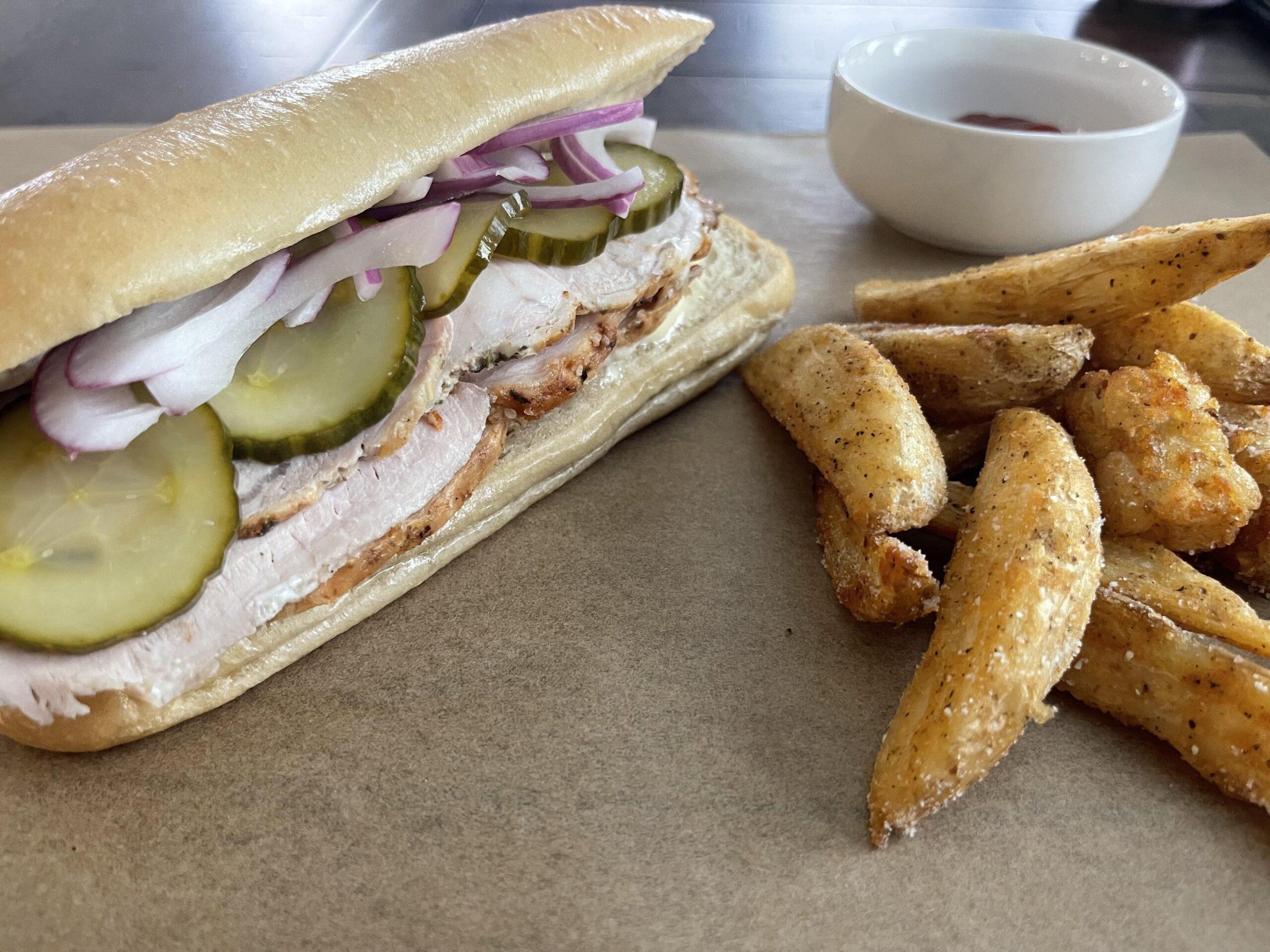 Herb de Provence roasted pork loin, homemade pickles, Japanese Mayo