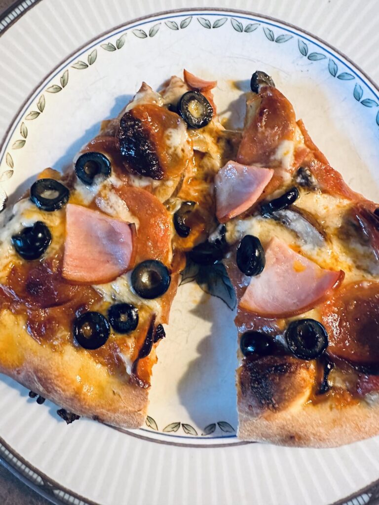 Mushrooms olives pepperoni and Canadian bacon pizza night