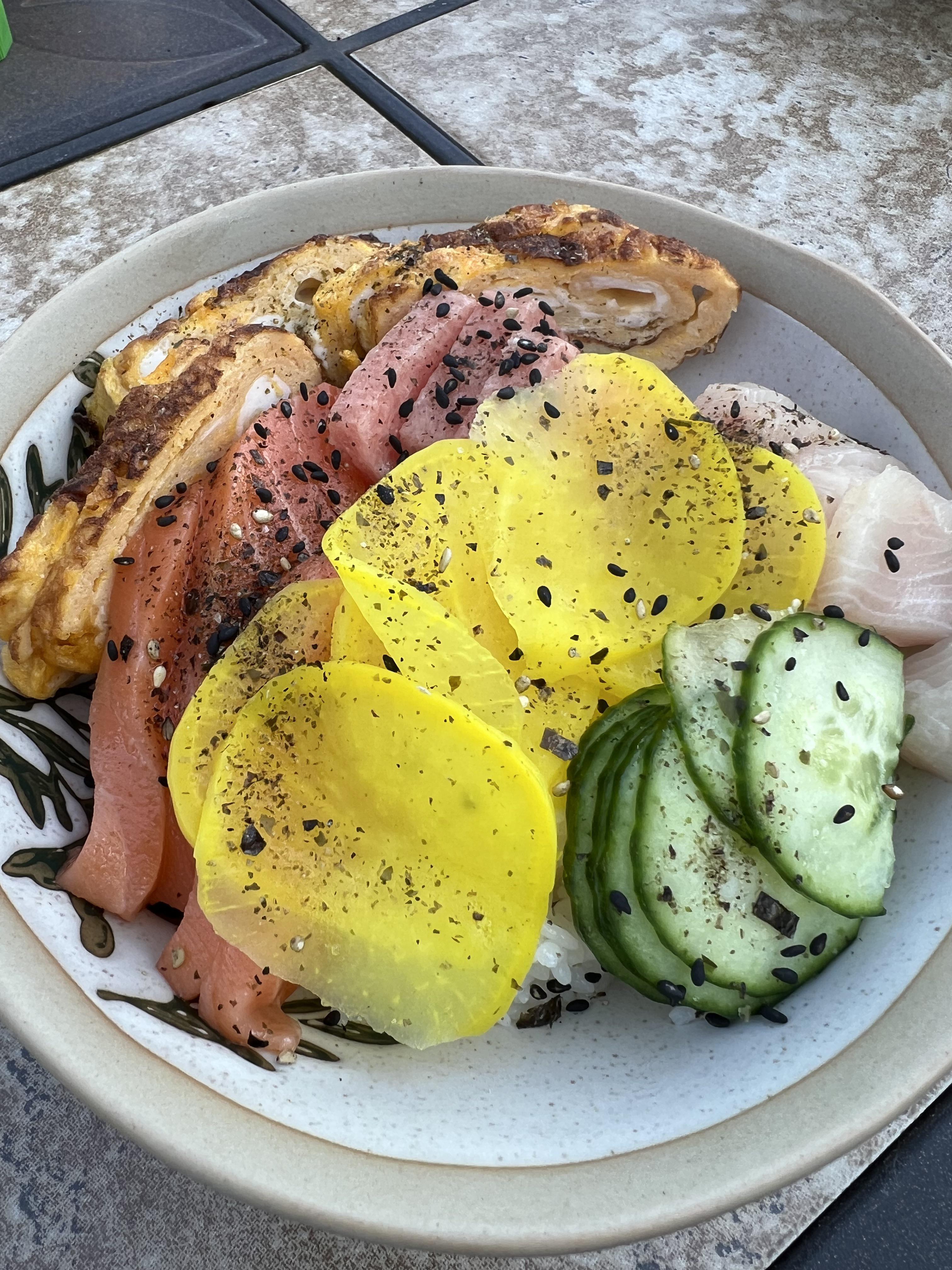 Homemade chirashi bowl with salmon, toro, hamachi, and tamagoyaki and