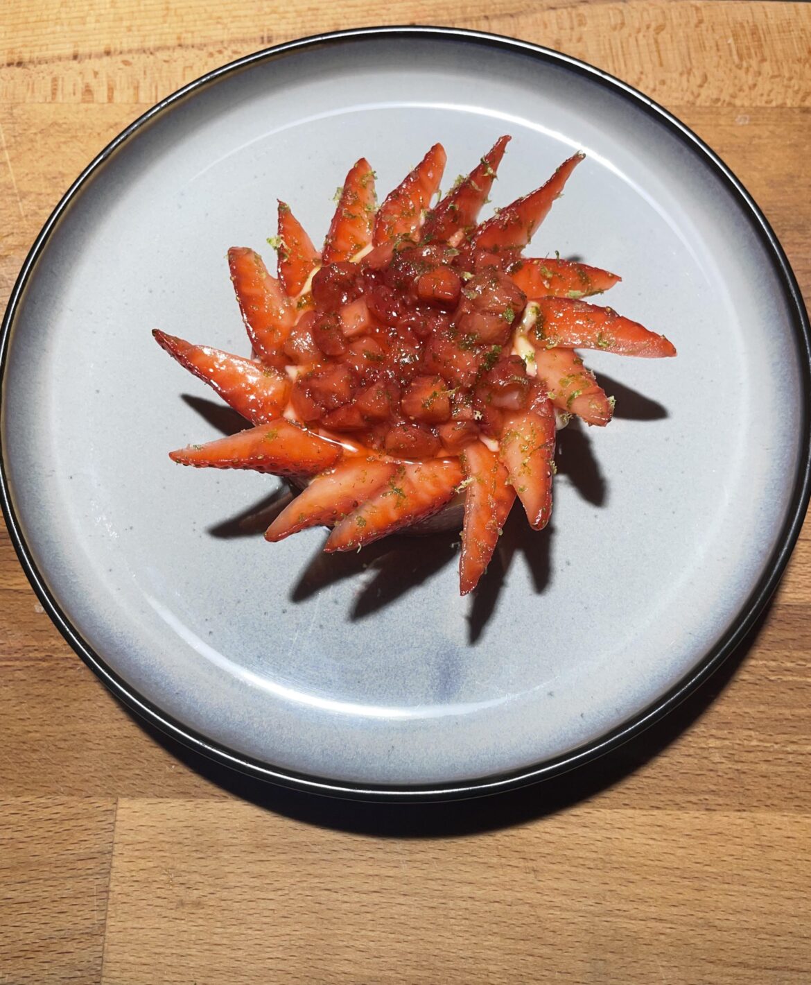Strawberry tart ,Crème patissiere, apricot and cinnamon jam,vanilla sponge cake,strawberry compote, fresh strawberries and topped with lime zest